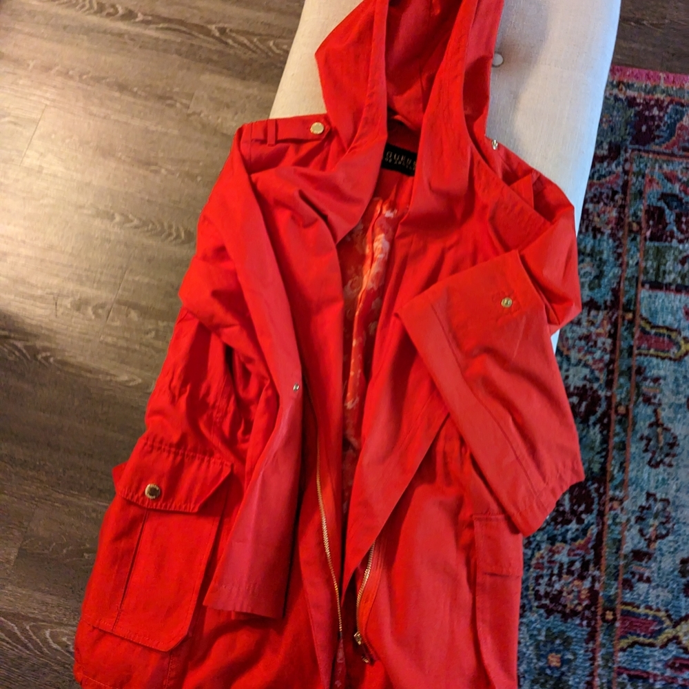 Orange Guess Raincoat with drawcord bottom, front snap pockets, gold hardware